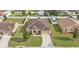Charming single-story home with well-manicured lawn, mature trees, and a long driveway at 1975 Country Manor St, Bartow, FL 33830