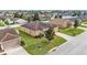Well-kept single-story home with manicured lawn, mature trees, and a cozy neighborhood setting at 1975 Country Manor St, Bartow, FL 33830