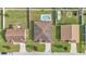 Aerial view of a well-maintained home featuring a classic roof and concrete driveway and neat landscaping at 1975 Country Manor St, Bartow, FL 33830