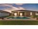 A beautifully landscaped backyard with a sparkling pool and screened-in patio for outdoor enjoyment at 1975 Country Manor St, Bartow, FL 33830