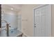 Bright bathroom featuring a modern glass bowl sink, a decorative mirror, and tiled walk-in shower at 1975 Country Manor St, Bartow, FL 33830