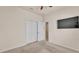 Spacious bedroom with a closet, white walls, and a modern ceiling fan at 1975 Country Manor St, Bartow, FL 33830