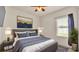 Comfortable bedroom with a queen bed, modern decor, a window with blinds, and ambient lighting at 1975 Country Manor St, Bartow, FL 33830