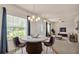 Bright dining room featuring a modern chandelier, neutral paint, and natural light at 1975 Country Manor St, Bartow, FL 33830