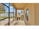 Relaxing screened lanai showcasing a refreshing pool view, comfortable seating, and lush plants at 1975 Country Manor St, Bartow, FL 33830