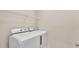 Bright laundry room featuring a modern, front-loading washer and dryer set and storage shelf at 1975 Country Manor St, Bartow, FL 33830