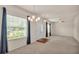 Bright living room with carpet, ceiling fan, natural light, and neutral paint at 1975 Country Manor St, Bartow, FL 33830