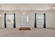 Bright living room with carpet, ceiling fan, natural light, and neutral paint at 1975 Country Manor St, Bartow, FL 33830