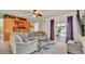 Comfortable living room featuring a spacious sectional sofa and sliding glass doors to the outdoor area at 1975 Country Manor St, Bartow, FL 33830