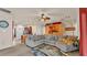 Stylish living room with an open concept, large comfortable couch, and easy access to the modern kitchen at 1975 Country Manor St, Bartow, FL 33830
