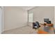Office with built in desk and storage, neutral walls, carpet, and a single window at 1975 Country Manor St, Bartow, FL 33830
