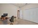 Office with built in desk and storage, neutral walls, carpet, and closet with double doors at 1975 Country Manor St, Bartow, FL 33830