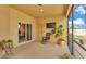Covered patio with tile floors, sliding glass doors, a tv, and comfortable seating create the perfect outdoor retreat at 1975 Country Manor St, Bartow, FL 33830