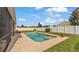 Beautiful in-ground pool with a concrete deck and fenced-in yard, perfect for summer days at 1975 Country Manor St, Bartow, FL 33830