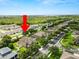 A charming two-story home with a well-manicured lawn and proximity to green spaces in a lovely neighborhood at 228 Magneta Loop, Auburndale, FL 33823