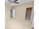 Bedroom featuring a neutral color palette and closet space for a serene and functional space at 228 Magneta Loop, Auburndale, FL 33823