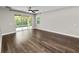 Empty bedroom with wood floors, lots of light, and sliding glass doors opening to the outside at 228 Magneta Loop, Auburndale, FL 33823