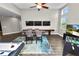 Bonus room featuring hardwood floor, media center, and game table with seating at 228 Magneta Loop, Auburndale, FL 33823