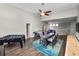 Upstairs bonus room with several entertainment options and relaxed seating area at 228 Magneta Loop, Auburndale, FL 33823