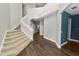 Bright, open foyer with hardwood flooring and stairway leads to the upper level at 228 Magneta Loop, Auburndale, FL 33823