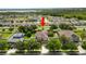 A charming two-story home with a well-manicured lawn and mature landscaping at 228 Magneta Loop, Auburndale, FL 33823