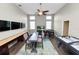 Spacious game room features a shuffleboard, a table, a foosball table, a pool table and three wall-mounted televisions at 228 Magneta Loop, Auburndale, FL 33823