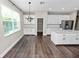Bright kitchen with stainless steel appliances and white cabinets, offering plenty of room at 228 Magneta Loop, Auburndale, FL 33823