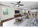 Bright and spacious living room showcasing a modern decor, with hardwood floors and great lighting fixtures at 228 Magneta Loop, Auburndale, FL 33823