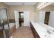 Main bathroom featuring a soaking tub, a separate shower, dual sinks, and access to the main bedroom at 228 Magneta Loop, Auburndale, FL 33823