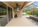 Screened outdoor living area with TV and pool offering relaxation and entertainment at 228 Magneta Loop, Auburndale, FL 33823