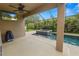 Spacious outdoor living area featuring a pool and lush tropical landscaping for a relaxing retreat at 228 Magneta Loop, Auburndale, FL 33823