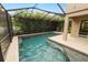 This is a view of a beautiful screened-in pool surrounded by a tiled patio at 228 Magneta Loop, Auburndale, FL 33823