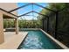 View of the pool and spa in the screened-in patio at 228 Magneta Loop, Auburndale, FL 33823