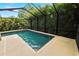 This is a view of a screened-in pool and tiled patio at 228 Magneta Loop, Auburndale, FL 33823