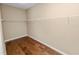 Spacious walk-in closet with hardwood floors and plenty of shelf hanging storage at 228 Magneta Loop, Auburndale, FL 33823