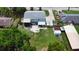 Spacious backyard featuring a patio area, outdoor seating, and ample green space, perfect for relaxation and entertainment at 2333 Cheshire Pl, Lakeland, FL 33810