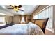 Spacious bedroom features a ceiling fan, neutral tones, and large windows at 2333 Cheshire Pl, Lakeland, FL 33810