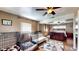 This bedroom provides multiple closets, a ceiling fan, and an attached bonus room with natural light at 2333 Cheshire Pl, Lakeland, FL 33810