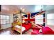 Unique bedroom with a wood frame canopy bed, hardwood flooring and an accent wall at 2333 Cheshire Pl, Lakeland, FL 33810