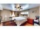 Comfortable bedroom boasts a ceiling fan, window, and a large bed at 2333 Cheshire Pl, Lakeland, FL 33810