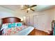 Spacious bedroom boasting hardwood floors, a ceiling fan, and a closet at 2333 Cheshire Pl, Lakeland, FL 33810