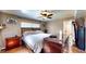 This bedroom offers a ceiling fan, tan colored walls, an updated window, and decorative touches at 2333 Cheshire Pl, Lakeland, FL 33810