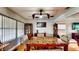 Charming dining room with a decorative ceiling fan and ample seating around the table at 2333 Cheshire Pl, Lakeland, FL 33810