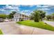 Attractive two-story home with a spacious driveway, well-manicured lawn, and charming front porch at 2333 Cheshire Pl, Lakeland, FL 33810