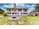 Charming two-story house with a decorative fountain and a well-manicured lawn at 2333 Cheshire Pl, Lakeland, FL 33810