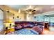 Comfortable living room with a large sectional sofa and an open layout to the dining area at 2333 Cheshire Pl, Lakeland, FL 33810