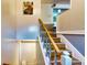 Bright staircase featuring wood treads, painted risers, and a classic handrail at 2333 Cheshire Pl, Lakeland, FL 33810
