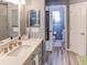 Bathroom with vanity sink, and view into the toilet room at 244 Kings Pond Ave, Winter Haven, FL 33880