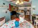 Open floor plan showcasing a kitchen with white cabinets, stainless steel appliances, and breakfast bar at 244 Kings Pond Ave, Winter Haven, FL 33880