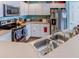 Well-lit kitchen featuring stainless steel appliances, countertops, and white cabinets at 244 Kings Pond Ave, Winter Haven, FL 33880